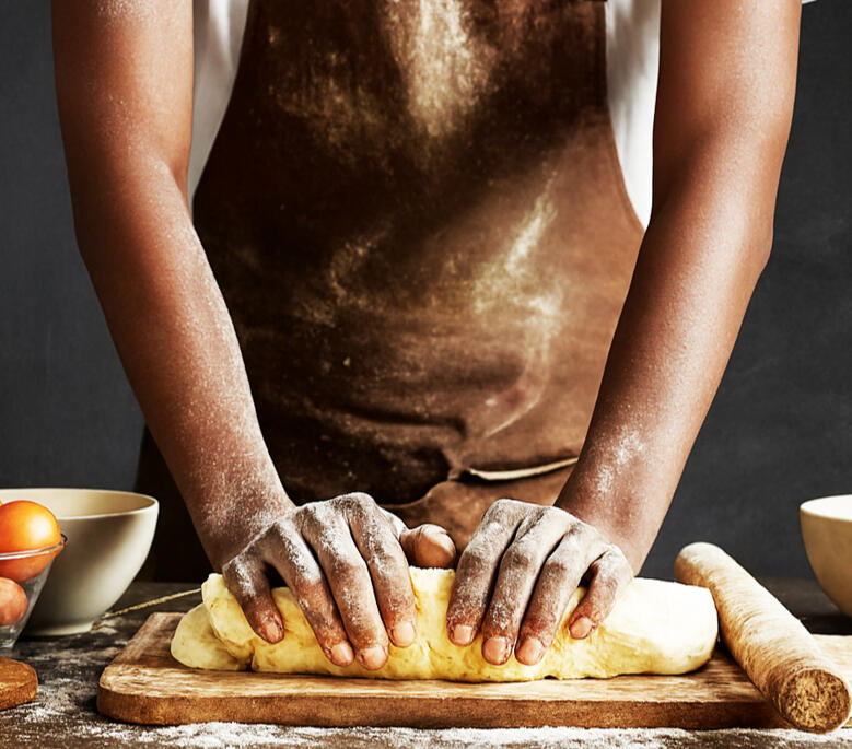 About the Baker Leonard Hiine, baker and founder of Lebo Bakes, standing in his bakery